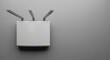 © Elenba - Modern wireless router on light gray wall, close up. Wireless router for high speed internet access at home or in office ensures seamless connectivity, offering reliable network capabilities.