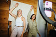 © Jacob Lund - two friends dancing and recording a video with a smartphone setup