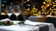 © syhin_stas - Elegant restaurant interior preparing for festive Christmas celebrations, showcasing a beautifully decorated table with a sophisticated wine glass and holiday garland