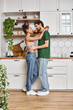 © LIGHTFIELD STUDIOS - Cozy moments in a modern kitchen shared by a young couple immersed in love and warmth