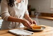 © Zireael - Latina woman baking pumpkin pie in home kitchen. cozy autumn baking concept for thanksgiving preparation.