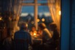 © matucha12 - Family gathered at dinner table seen through window