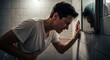 © Rommy - Stressed person gripping stomach in bathroom, feeling sick and nauseous, struggling with illness, seeking relief, health concern, digestive problem