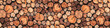 © MonTeArt - Decorative cut wood background with round log sections in warm brown tones
