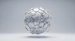 © ayu - White marble sphere composed of hexagonal and circular tiles floating in a minimalist grey studio