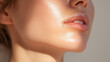 © Marut - Glowing hydrated skin close up light reflecting on smooth chin healthy complexion natural beauty soft lips radiant skincare youthful fresh serene