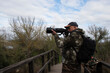 © Jaume Rosselló - Nature photographer pointing his camera at some wildlife in the Albufera de Alcúdia Natural Park (Mallorca).