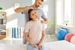 © Studio Romantic - Skilled man therapist guides a woman through physiotherapy, including a rejuvenating neck massage and targeted stretching. Patient rehabilitation, sports medicine and physical therapy.