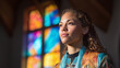 © Oleksandr - Thoughtful woman with curly hair in a church setting, bathed in light from stained glass. She looks serenely to the side, showcasing spirituality and peaceful contemplation.