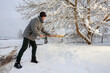 © agneskantaruk - Man is removing snow after the snowfall.