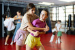 © JackF - Two teenage girls training self-defense techniques in pairs in studio