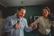 © Miljan Živković - Happy couple enjoying home karaoke singing with boombox