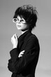 © SHOTPRIME STUDIO - Black and white portrait of a stylish woman with short hair and white sunglasses wearing a dark jacket.