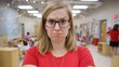 © Anat art - Stressed Kindergarten Teacher Dealing With Challenges in a Busy Classroom Setting During the School Day