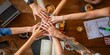 © Rawpixel.com - Diverse group of hands joining in teamwork over a wooden table. Collaborative teamwork with diverse hands. Teamwork and collaboration in a diverse setting.