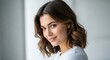 © Buba - Portrait of a Smiling Young Woman with Wavy Hair and Warm Expression