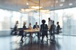 © Khawla - Blurred Modern Business Meeting in Bright Office