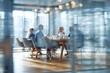 © Khawla - Blurred Modern Business Meeting in Bright Office