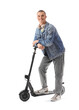 © Pixel-Shot - Teenage boy with electric scooter on white background