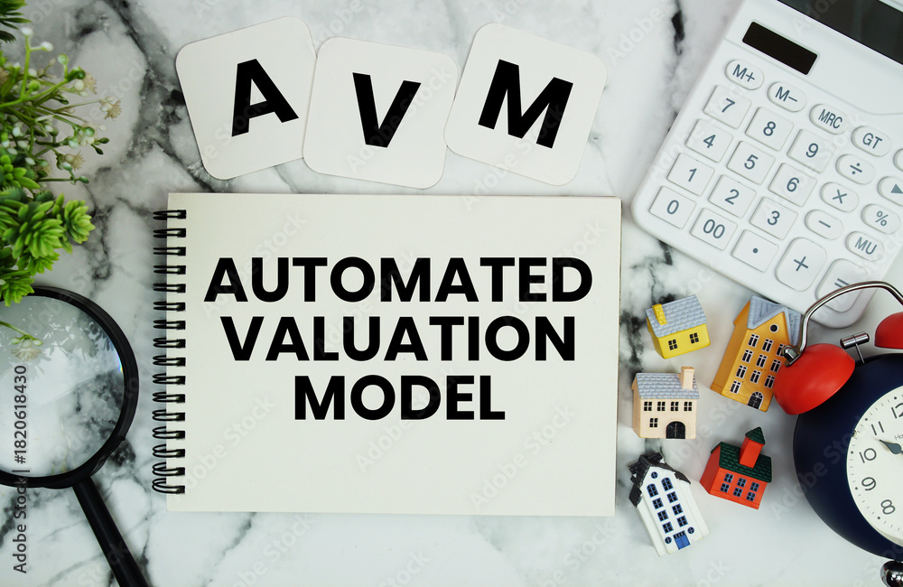 AVM Automated Valuation Model text written on notepad with house model ...