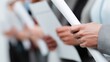© vlntn - Graduates Holding Diplomas in Formal Line