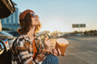 © SHOTPRIME STUDIO - woman fries car sunset beanie sunglasses parking casual enjoying golden hour glow with authenticity and candid lifestyle vibe, mindful living and emotional storytelling in urban roadside scene