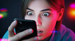 © CreativeIMGIdeas - An engaged woman stares intently at her smartphone screen, eyes wide with surprise, illuminated by a vivid and colorful glow.