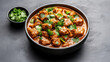 © siraphol - Kashmiri lamb rogan josh curry with fresh cilantro garnish, rich aromatic red sauce