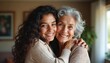 © miss irine - Young woman hugs elderly mother tenderly inside house. They share loving bond smiling warmly at camera, enjoying moments of close family connection. Generation gap bridged with affection.
