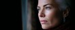 © ckybe - The woman’s thoughtful expression reflects a serene and contemplative mood through the window.