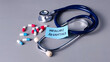 © MohamadFaizal - Medicare Advantage Concept with Stethoscope, Note, and Capsules on Gray Background