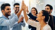 © N7 - Joyful Indian Office Team Marking Milestone with High-Fives and Collaboration