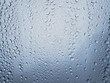 © Tetra Images - Close-up of raindrops on windowpane glass