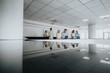© qunica.com - A group of colleagues gather near a reception desk in a bright, contemporary office.