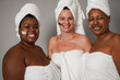 © Sabrina - Happy multiracial women smiling in front of camera during skin care treatment - Spa day, friendship and multi generational people concept