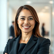 © Amasha1996 - Realistic portrait of a confident smiling business woman, clean blurred office background, perfect studio lighting, natural skin texture, professional corporate headshot, 4MB high-resolution DSLR