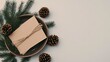 © lililia - A peaceful flat lay featuring an A5 card mockup amidst pine branches, pine cones, and an elegant dish, all styled on a white linen table in natural light