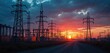 © Vadym - High voltage power lines, metal towers stand silhouetted against dramatic red orange sunset sky. Electric substation shows crucial energy infrastructure for electricity distribution, supply.