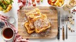 © StudioWorld - French toast with powdered sugar and breakfast items