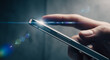 © CreativeIMGIdeas - A person's hand interacts with a sleek smartphone, hinting at modern connectivity and digital lifestyle. The scene is illuminated by a captivating lens flare.