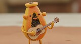 Animated papaya character playing acoustic guitar, cheerful and musical.