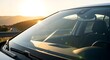 © Zeeshan Sharfi - Car windshield view at sunset: golden hour road trip, automotive travel, and scenic driving adventure for transportation advertising