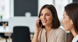 © Tatiana - Woman talking on phone and smiling in office setting. Business communication and teamwork. Happy professional woman in modern workplace for business concept.