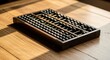 © Sohel Rana - Traditional wooden abacus calculator on a warm wooden table surface