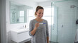 © D-stock photo - Portrait of smiling young woman holding pregnancy test in bathroom at home