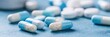 © Mi - Against a blurred background, blue and white blister packs of antibiotic capsules and tablets are displayed. Online pharmacy banner. World Health Day. Pharmaceutical industry. Prescription drugs. Conc