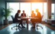 © Michael - Defocused abstract background featuring a modern meeting room with natural light and a professional team collaborating. Ideal for business and corporate visuals. High quality