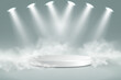 © Hanna - White round podium with bright spotlights and soft fog on light background