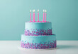 © Ozz - Festive birthday cake with lit candles and colorful sprinkles on a white surface