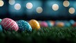 © rokhmahmundiarsonono - A row of colorful, decorated Easter eggs rests on green grass, with soft, out-of-focus bokeh lights in the background, creating a festive and magical atmosphere